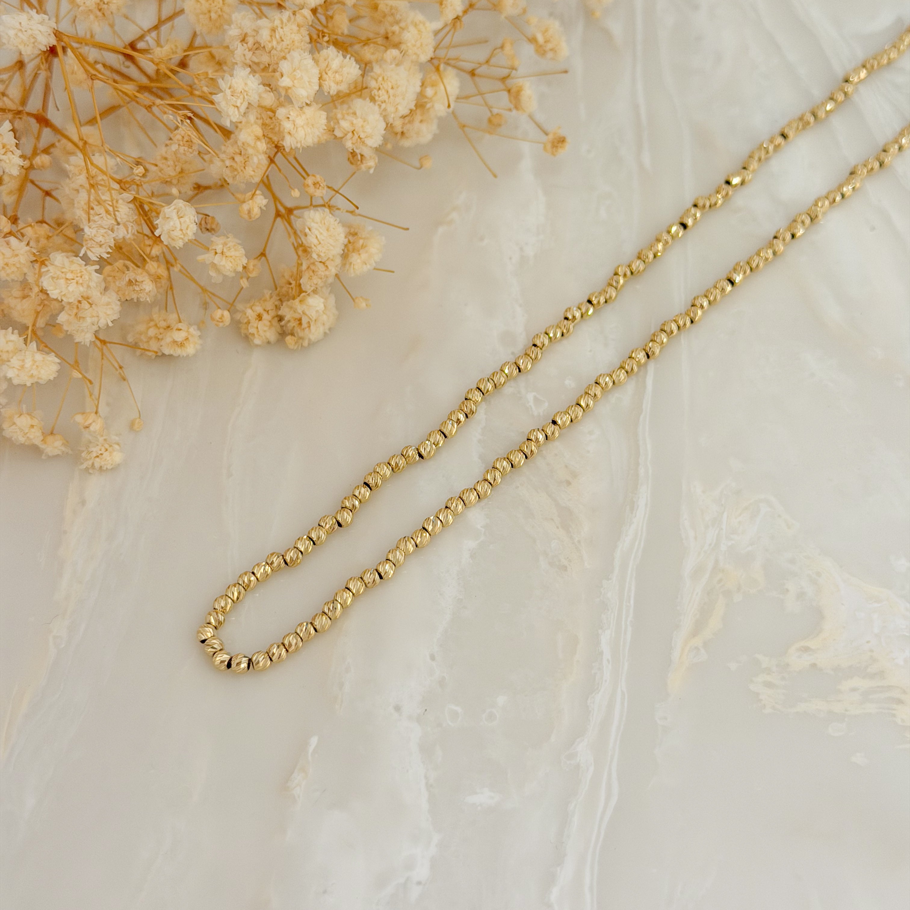 Łańcuszek z diamentowanymi kulkami 47-50 cm próba 585 3 mm